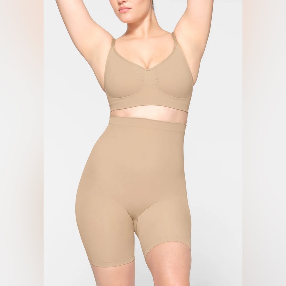 SKIMS High-Waist Mid-Thigh Shapewear Shorts in Nude